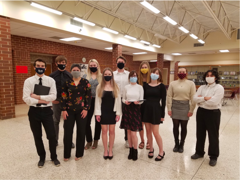 Students who participated in the reader’s theatre for speech stand for a picture. The group received straight ones at state on Saturday.