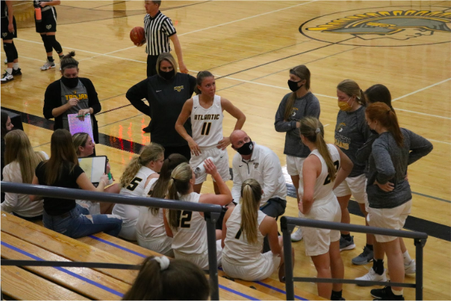 Encountering new regulations, the girls basketball team stayed masked as often as they could. The girls were able to play all of their games this season despite COVID. 