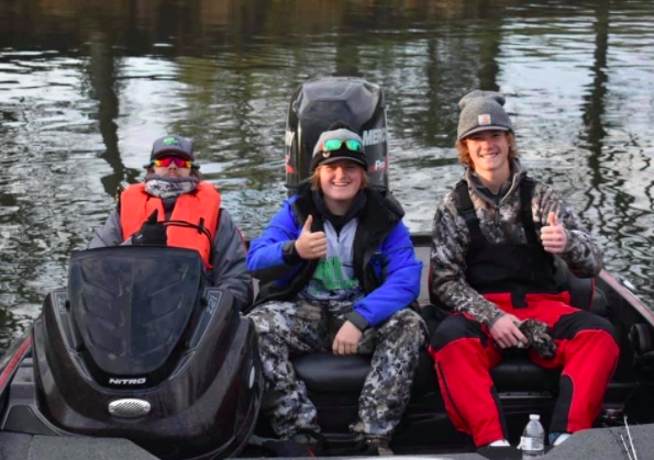 Seniors Brendan Atkinson, Drey Newell, and Braden Smith smile on the pond. The boys have placed second in two tournaments.