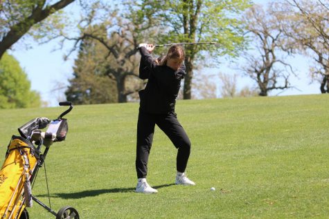 Sophomore Abby Smith preps for a swing at a home meet. A large portion of the girls golf team consists of underclassmen who didnt have the opportunity to play last season. 