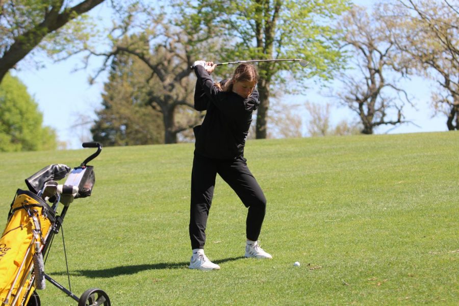 Sophomore Abby Smith preps for a swing at a home meet. A large portion of the girls golf team consists of underclassmen who didn't have the opportunity to play last season. 