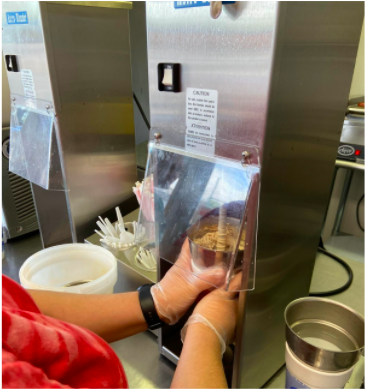 Racheal Maxwell mixes a cookie dough concrete for a customer during the dinner rush. 