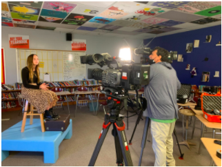 Brynna Kern is ready to film with Iowa PBS. She was interviewed about her award-winning video about Zoey Moore and her new wheelchair. Kern said that she was proud that she won the award for “Zoey’s In The Driver’s Seat.”