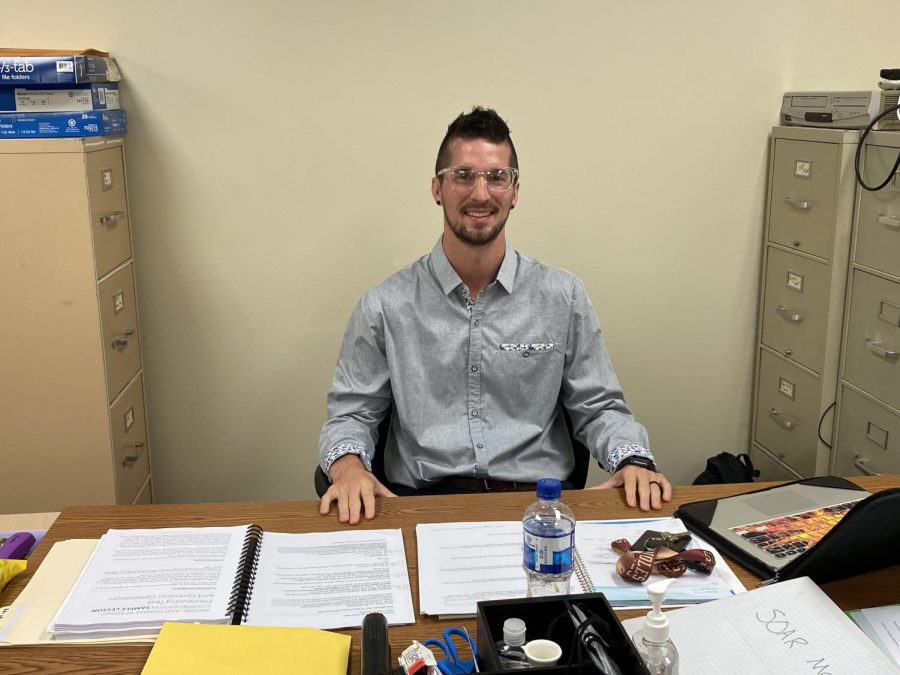 Jesse McCann waits at his desk eager to teach his new students. 