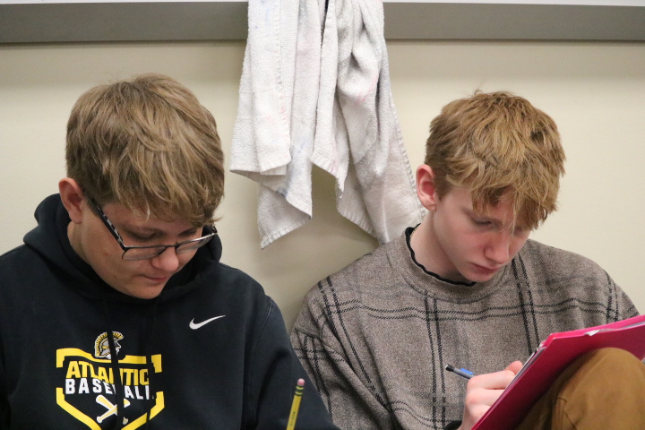 Toby Thomas and Trahyger Carey sit against the wall in their geometry class. The class frequently worked in pairs. Mrs. Sonntag taught all sections of geometry.