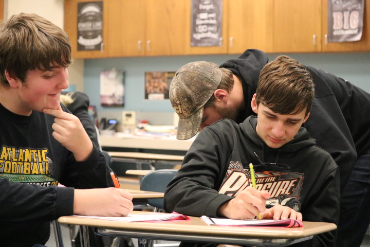 Dawsen Sorensen, Wyatt Simons, and Keegan Kemp laugh while still focusing on their assignment. They incorporated some fun into the process of learning. It was a great strategy, as they enjoyed getting their work done.