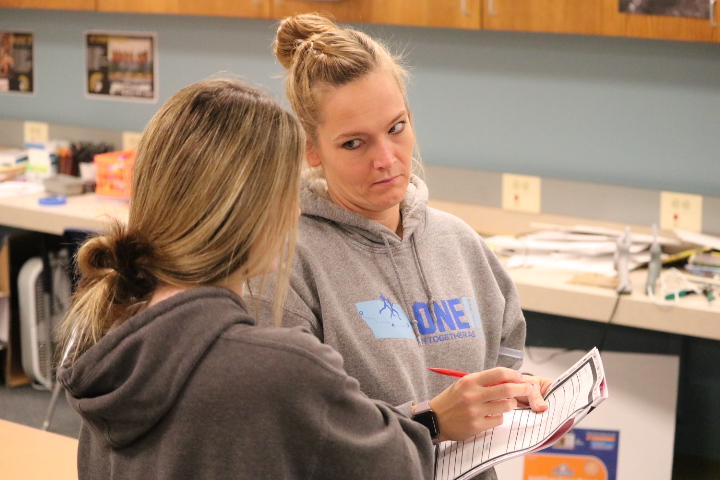 Jade Harter asks geometry teacher Lisa Sonntag for help with the homework. Mrs. Sonntag explained, but still more questions were asked. Harter continued until she understood!
