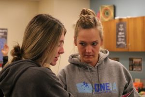 Jade Harter asks geometry teacher Lisa Sonntag for help with the homework. Harter is involved in basketball as well. 