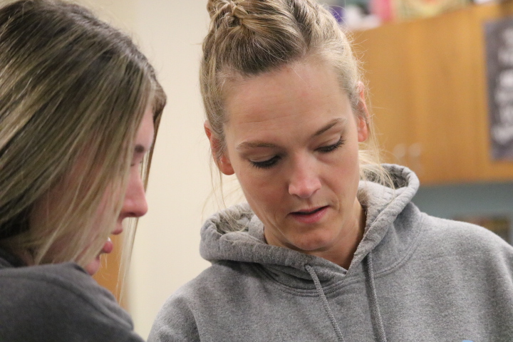 Jade Harter asks former Geometry teacher Lisa Sonntag for help with the homework on last years curriculum.