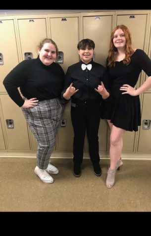 Juniors Charlotte Saluk, Alex Garcia, and Keira Olson prepare for their radio broadcasting piece. They earned a one-rating and will progress to state. 