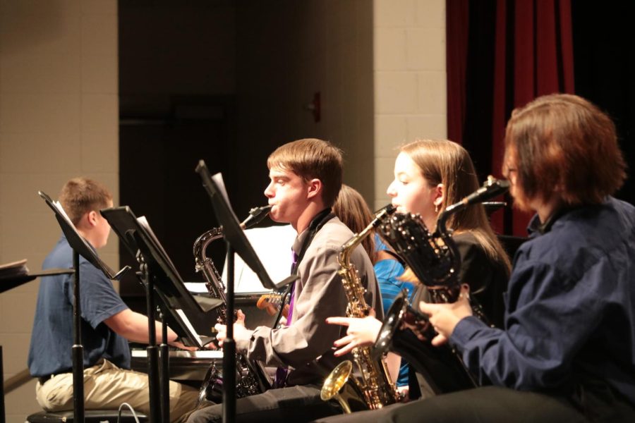 LOOKIN SAXY - Sophomore Braden Spurr, eighth-grader Margaret McCurdy, and freshman Alix Nath take the audience on a sweet saxophone ride. Parker Brock was on the piano.