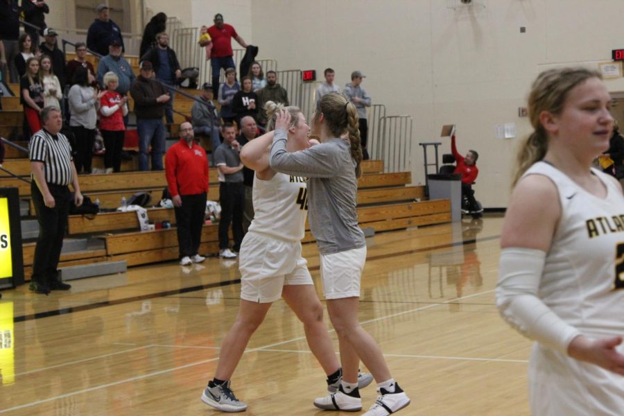 Senior Malena Woodward does her handshake with her Claire Pellett before a game.