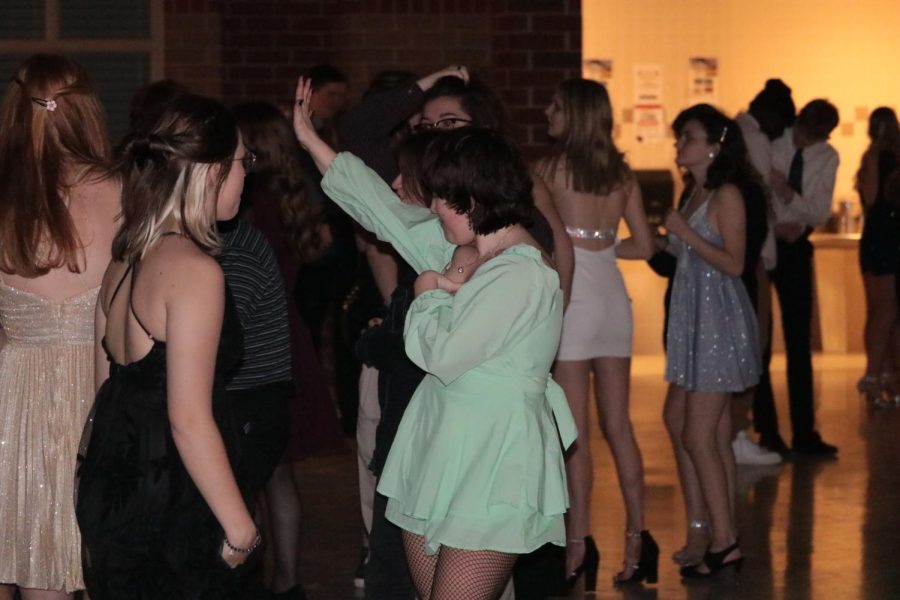 LETS DANCE- Sophomore Addie Welsh dances the night away with her peers. She is involved in choir and show choir. She works very hard on those throughout the year and said, it was nice to have a break.