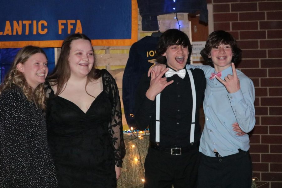 POSING FOR THE CAMERA- Juniors Abbi Richter and Christine Thomas pose for a picture with freshman AC Roller and Cade Smith. This is Richters favorite picture from the dance.