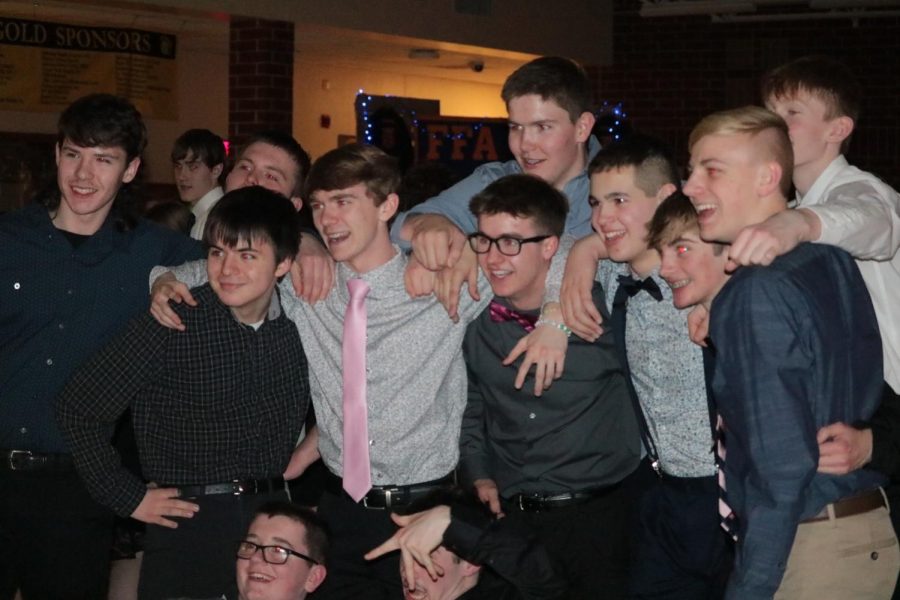 WITH THE GANG- A group of freshman and sophomore boys pose for a picture. The dress code required formal attire.