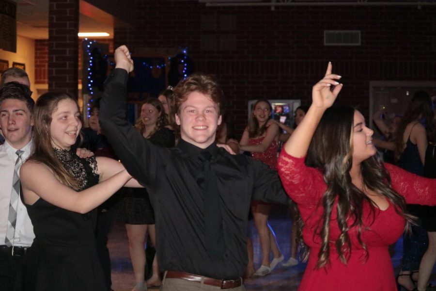 DANCIN IN A CIRCLE- Freshman Brianna Atkins,  and juniors Miles Mundorf and Sofia Mendez dance together. They attended winter formal together. Mendez was on winter formal court. She was escorted by Logan Eilits.