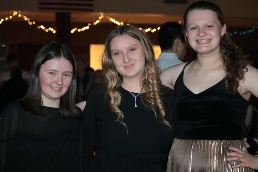 JUNIOR NEWSPAPER SQUAD- Juniors Dakota Oswalt, Elizabeth Anderson, and Eleanor McCalla pose for a picture at the dance. McCalla took pictures at the dance but took a break to hang out with her friends. All of them will be pursuing journalism during their senior year.