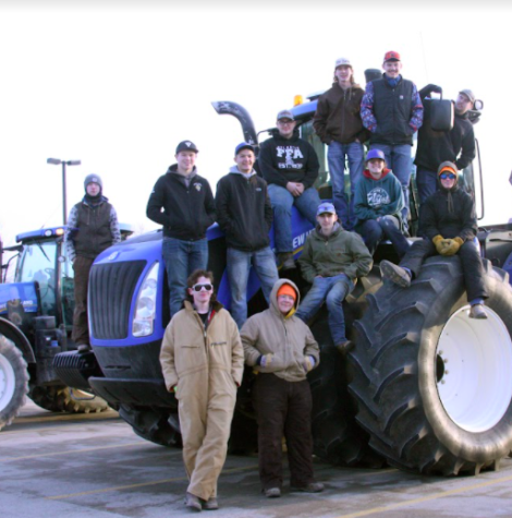 All twelve students gather together for a photo on tractor day.