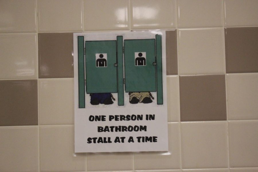 Signs have been put up in the bathrooms to remind students of  how many people belong in each stall. There was a rising issue with groups of students using the same stall. 