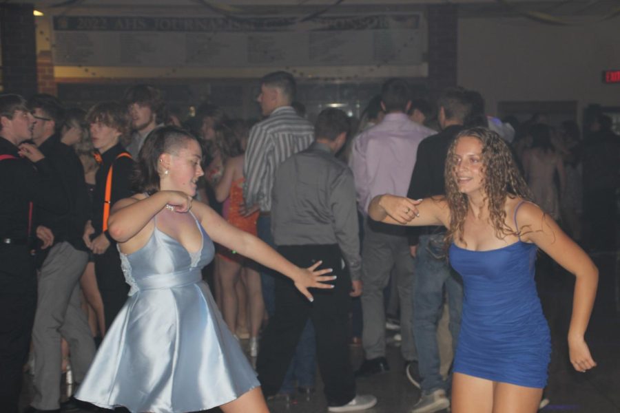 BUSTING A MOVE -- Juniors Addie Welsh and Quincy Sorenson break it down on the dance floor during Apple-Bottom Jeans. The two both stayed for the entirety of the dance. Sorensens favorite part of the dance was when there was a ginormous mosh pit.