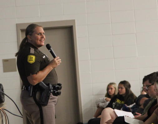 Iowa State Trooper Shelby McCreedy addresses the AHS student body. McCreedy stressed the dangers of social media.