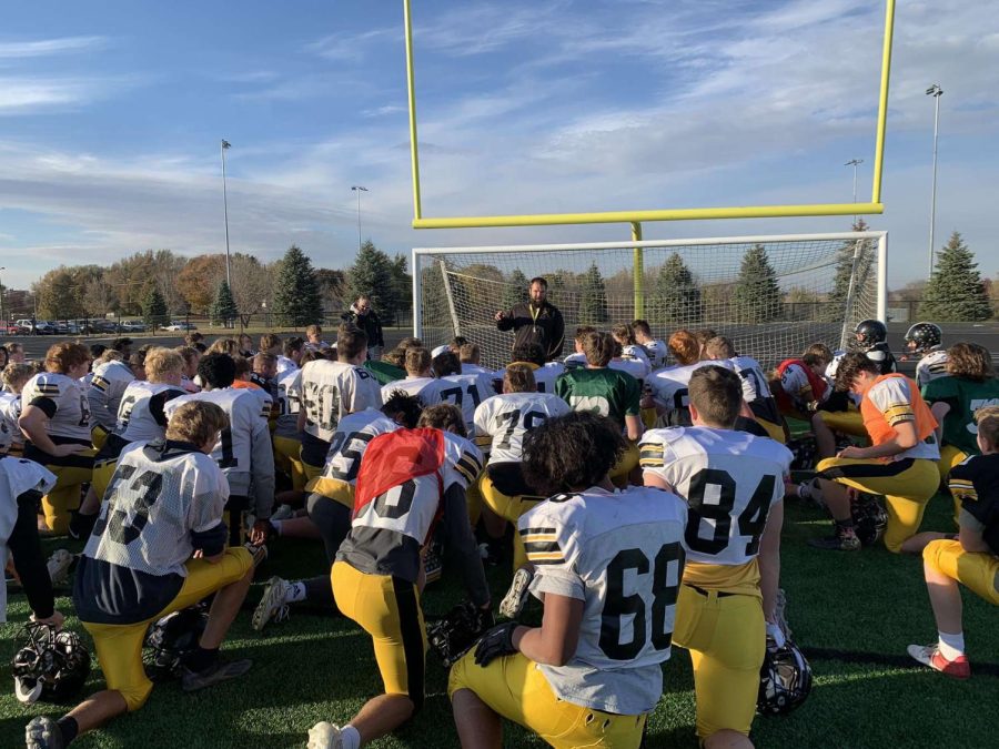 Coach Brummer talks to his team in the post practice breakdown. The team was 5-4 this season. There were 21 seniors on the team.