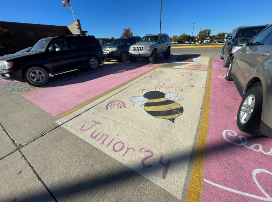 Junior Kyra Rink's parking spot features a bee in honor of her middle name, Bea. Students at AHS are "buzzing" about her painting.