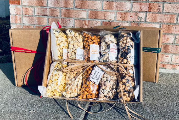 This Years Holiday Popcorn Gift Sampler offers five different flavors of popcorn this year. Those flavors include: Classic Cinema, Kettle Corn, Caramel Cheddar Explosion, Peppermint Bark, and Christmas Crack. The box costs 30 dollars.