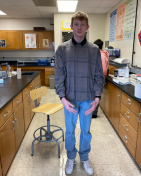 Junior Trahyger Carey poses for a fit check. Many people will see older trends in modern-day fashion choices.