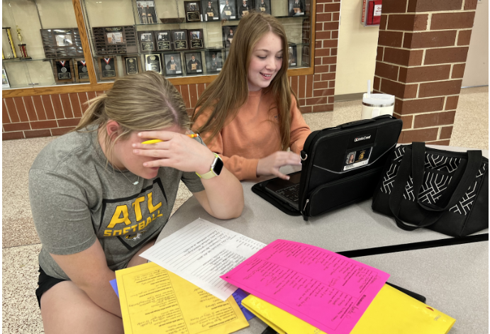Stressed-out freshman Aunika Darrow gets help from sophomore Emma Winford during fourth-period study hall. “Spanish is hard for me sometimes, so it is good to have a friend willing to help me out,” Currently, Darrow is writing sentences on present progressive form in Spanish class.  