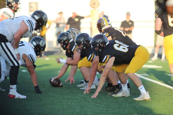 The Trojan offense lines up during their game against Glenwood.