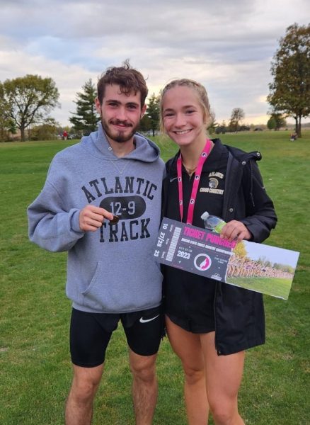 Bennett Whetstone and Claire Pellett show their awards for qualifying for the State Cross Country Meet. They will run Oct. 28 in Fort Dodge, Iowa.