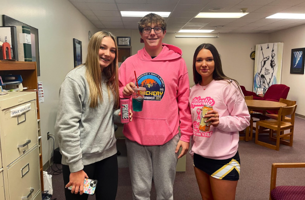 Freshmen Jillian Satthoff, Rayden Wheeler and Hallie Robinson show off their morning drinks of choice. (From left to right the drinks shown are a Prime energy drink, Scooters Infusion, and a Ghost energy drink.)