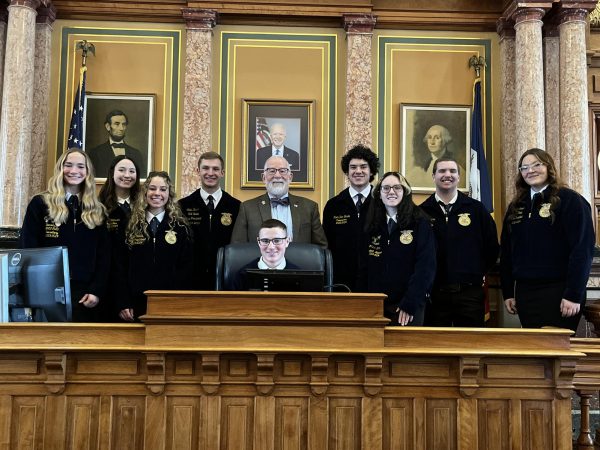 IN THE HOUSE - Left to Right- Claire Pellett, Lily Johnson, Lola Comes, SW State VP Colin Bauer, Rep Moore, Roth
DenBeste, Charli Goff, Wyatt Simons and NW State VP Jaydee Bremer. Seated is Colton Rudy.