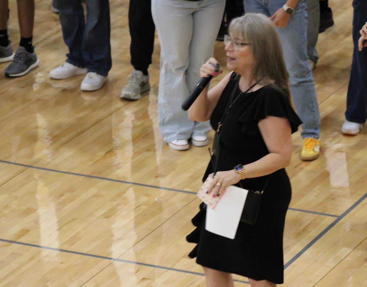 Principal Heather McKay speaks to a crowd on the first day of the 2024-2025 school year.