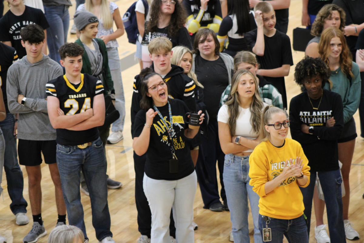 Students and staff serve as onlookers to the semi-final round of the school-wide rock-paper-scissors tournament. This was the tournament's second year of being held on the first day of school.