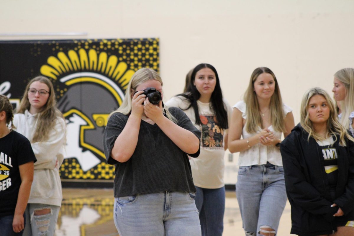 Annabelle Meyer takes photos on the first day of school Rock Paper Scissors tournament. Students competed for the chance to become the Rock Paper Scissors champion.