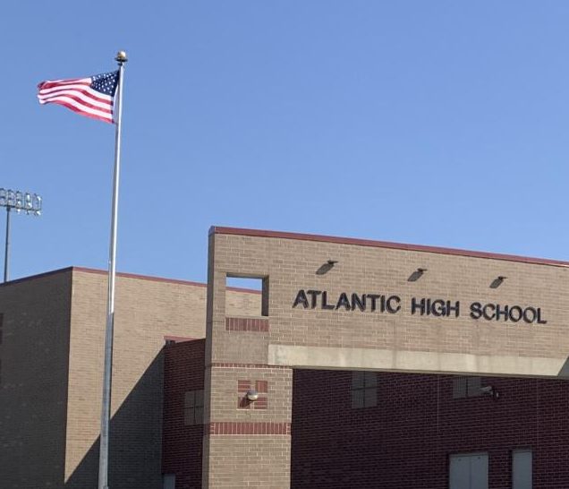 A police car stands posted outside the Atlantic High School on Monday, September 9, as a result of increased police security following the school shooting threat.