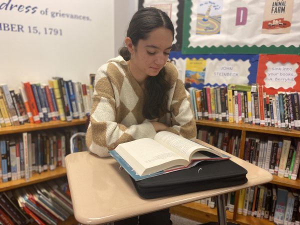 New AHS Student Iman Dzafic reads in her english class.