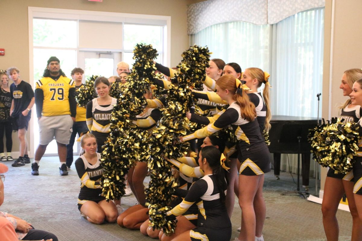 AHS Cheerleaders arrive at Heritage House to perform some stunts and cheers for this years Homecoming! 