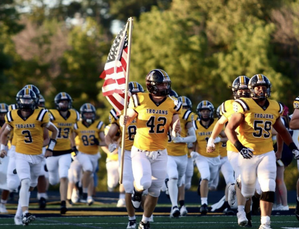 Junior Addie Freund snapped a shot of Trojan Football players entering their stadium to play the Indians. 