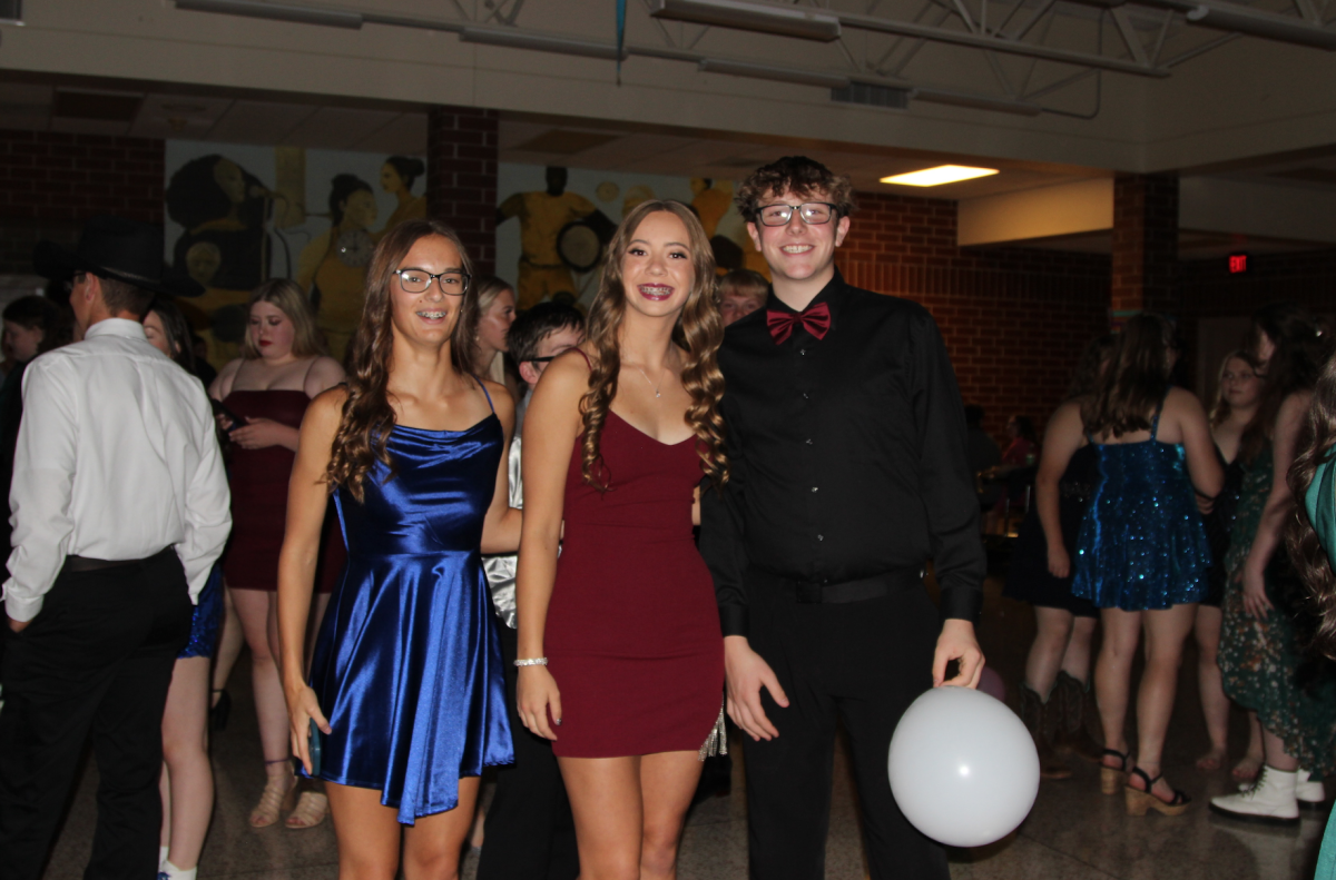 Allison Middents, Nelley Pelzer, and Rayden Wheeler rock it out at the 2023 Homecoming Dance.