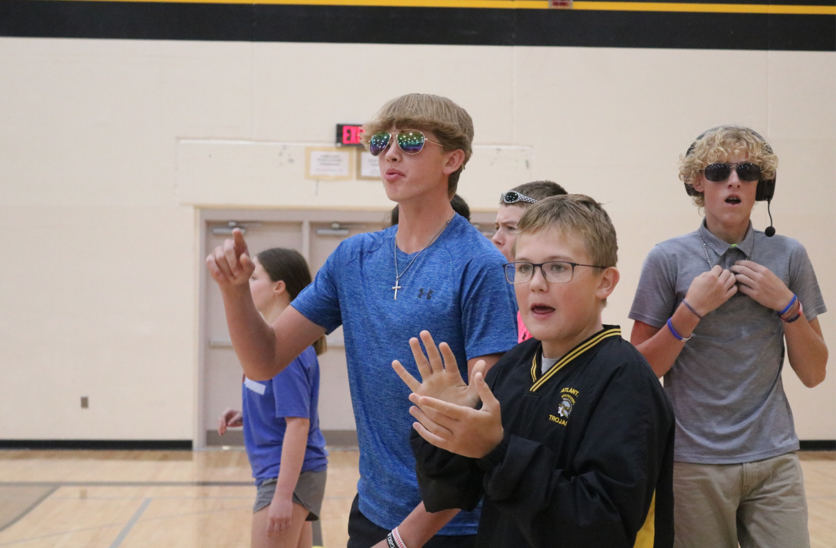 Grant Petty, Colin Harris, and Vincent Meisinger coach the girls for Homecoming dodgeball games.