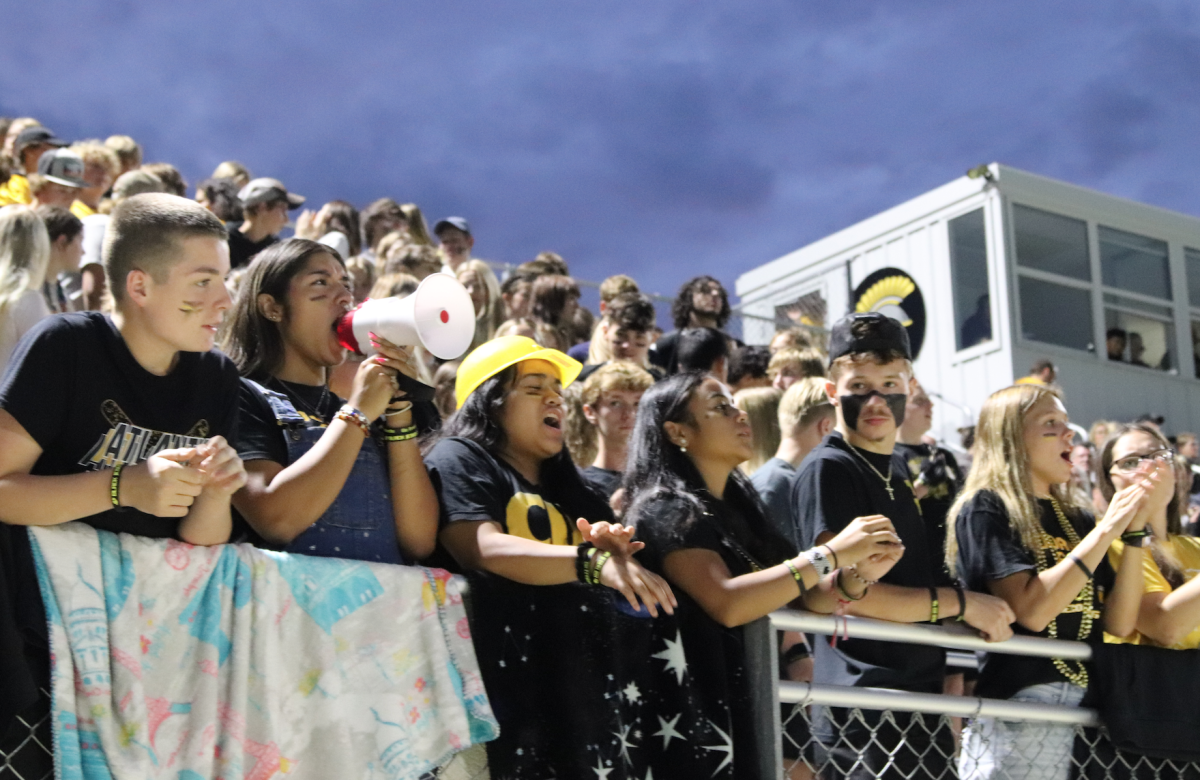 Student sections cheers at the 2023 Homecoming football game. 