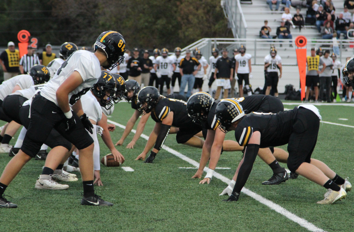 The varsity football team tries to stop Green County from scoring a touchdown, Sept. 13, 2024.