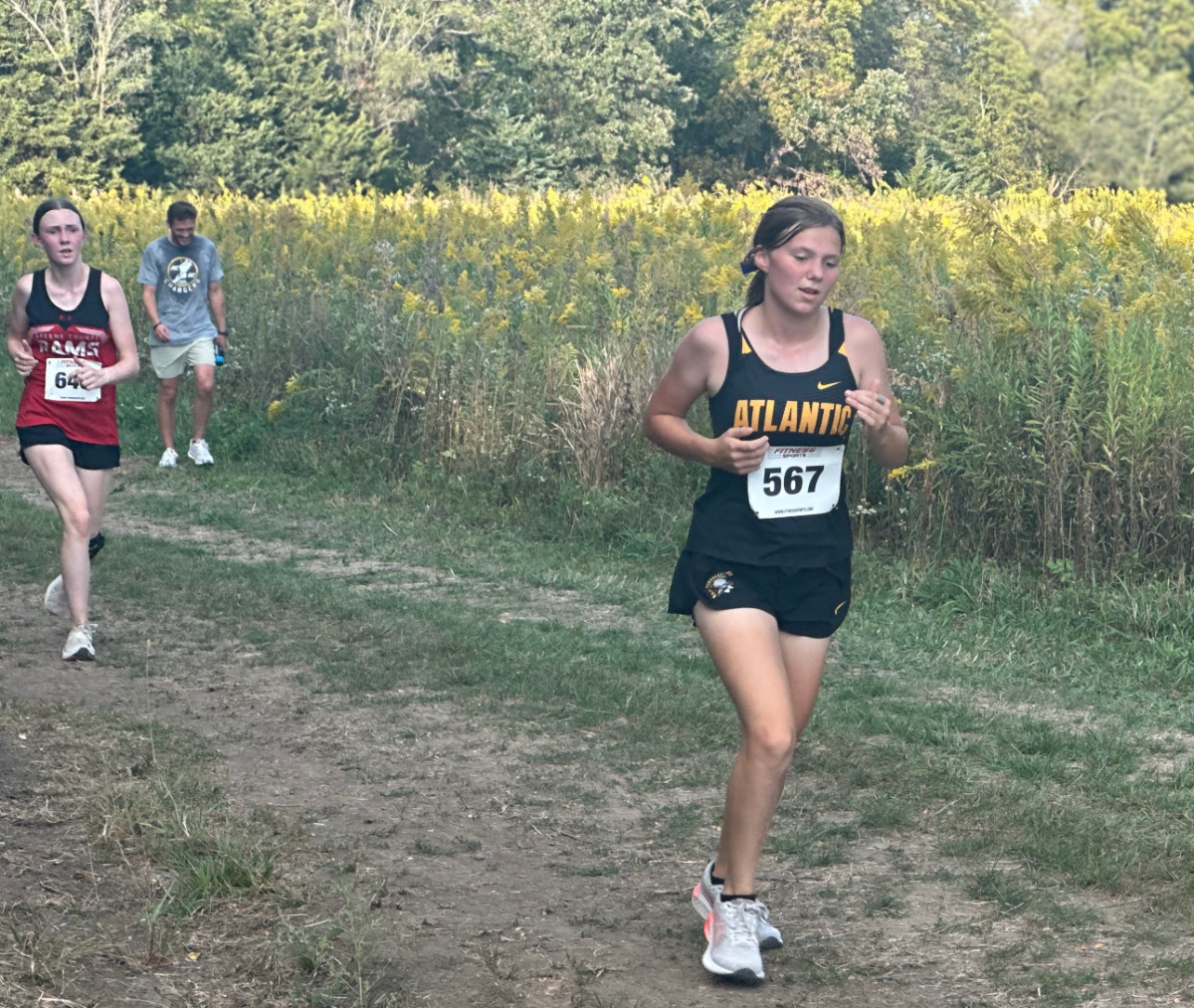 Sophomore Hailey White runs during her varsity cross country meet in Panorama!