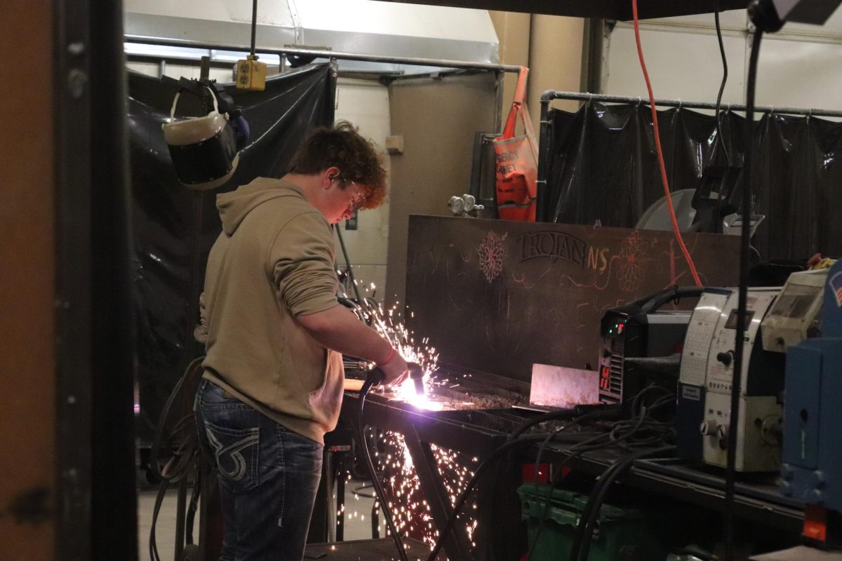 Shayden Bonar, a junior practices in the workshop for class during sixth period.