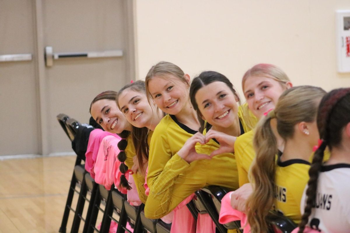 The J.V. Volleyball girls send love and support to people with breast cancer. Their home game on Oct 14 saw the gym sporting streamers and balloons, with the Atlantic team wearing matching bows and ribbons in their hair. Pink Out shirts were also draped over the teams' chairs.