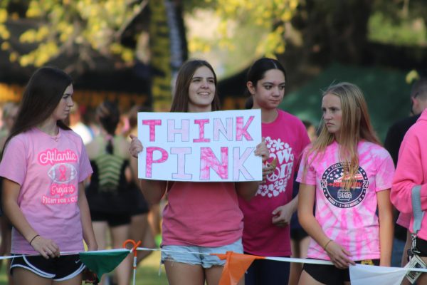 Students gather in support of the Cross Country Runners at the home meet. This was also the Cross Country team's Pink Out race and raised funds for Stephanie Kelley.