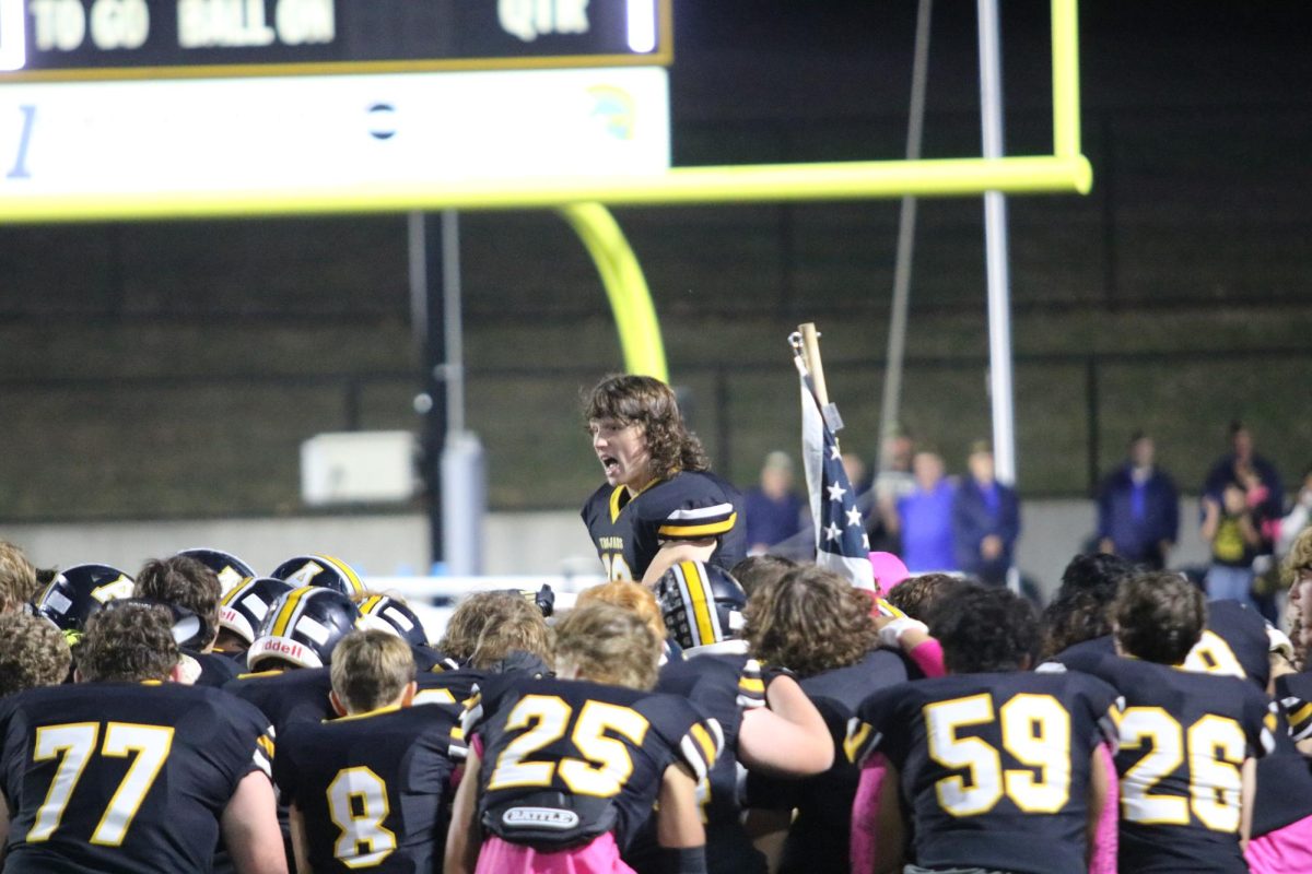 Senior football captain Jarrett Hansen gives a pep talk to his team before the Pink Out game on October 18, 2024.